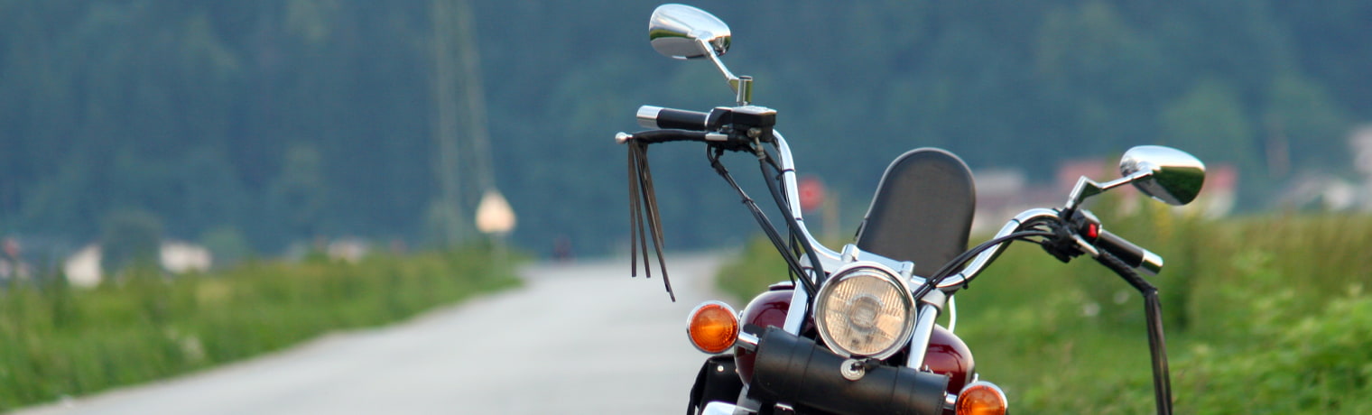 Photo of a motorcycle parked on the side of the road