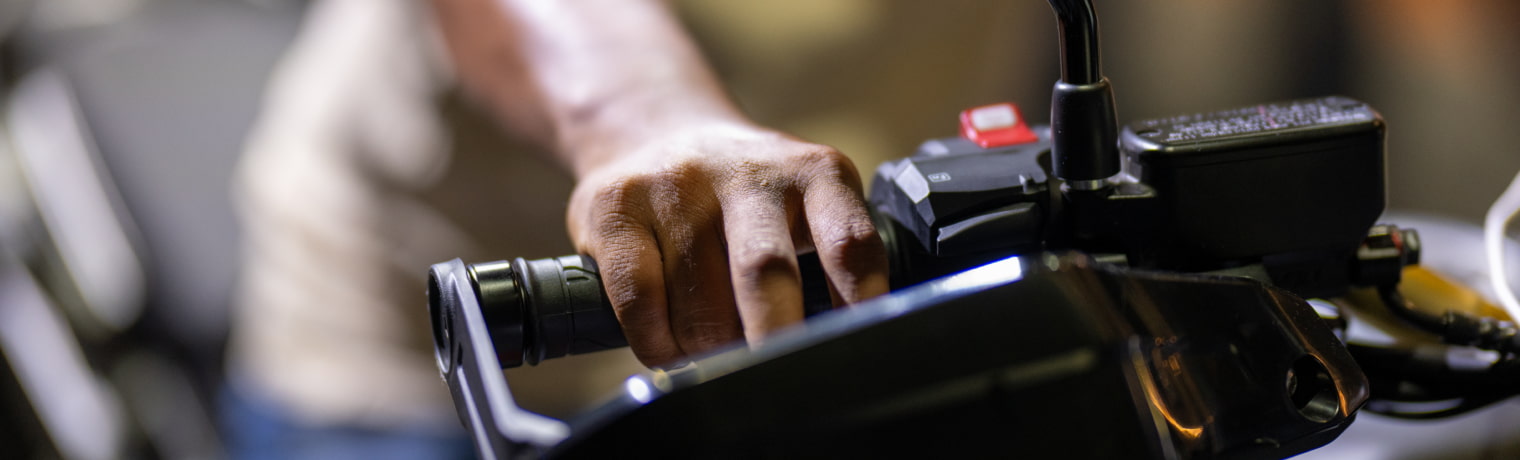 Photo of a hand on a handlebar