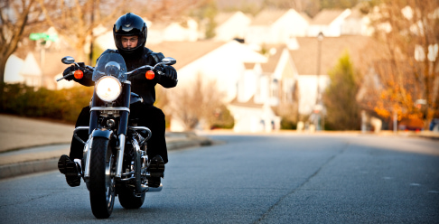 Photo of a motorcycle driving down the road