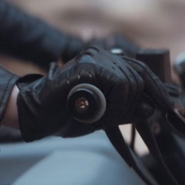 Hand on street bike throttle